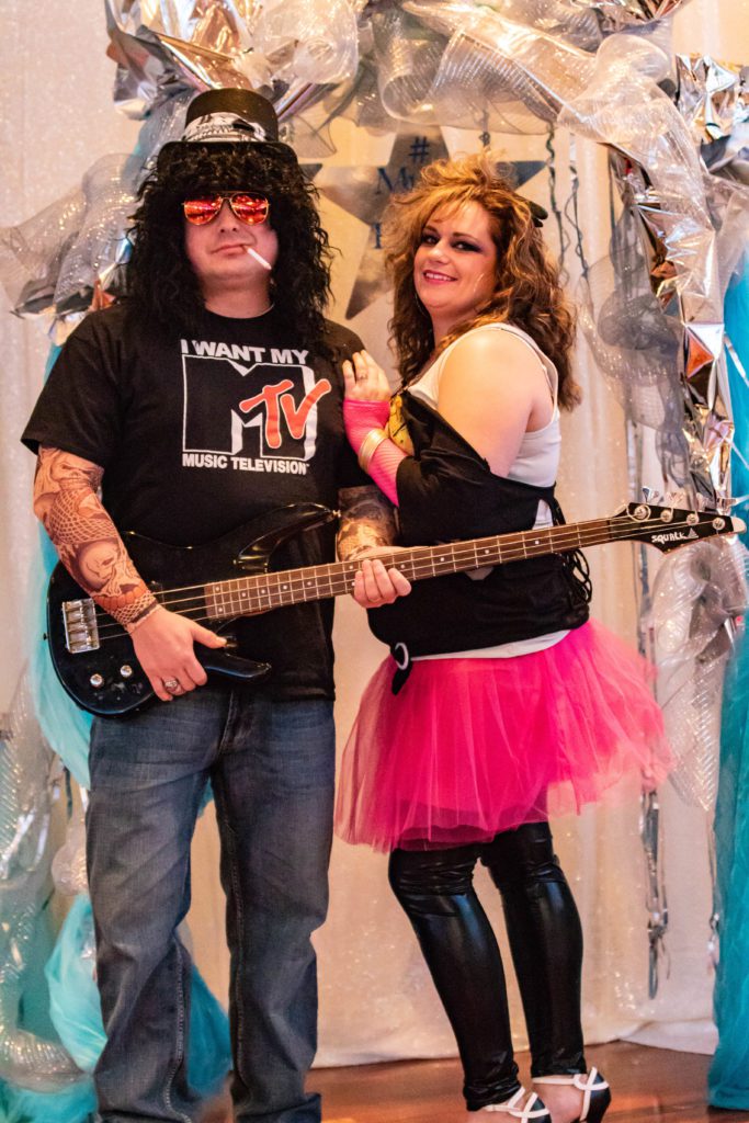 Couple dressed in 80's rocker clothes