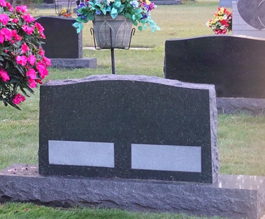 Peaceful photo of headstones in a cemetery